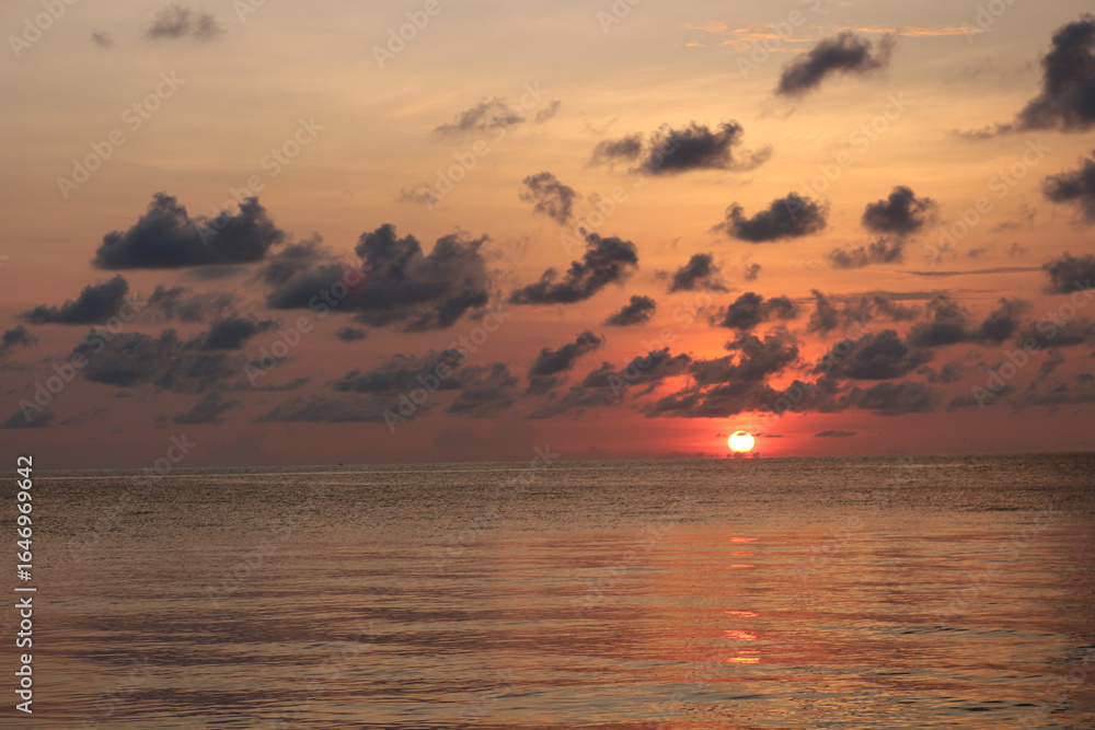 Naklejka premium Sunset Over Calm Ocean