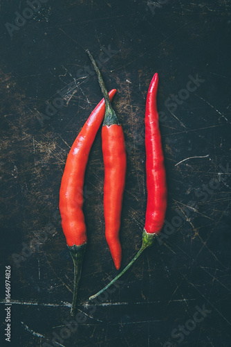 Tabasco chilies on a metal tray background