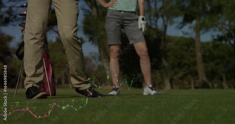 Fototapeta premium Standing couple wearing golf attire on golf course fairway, with golf bag, clubs, and glove