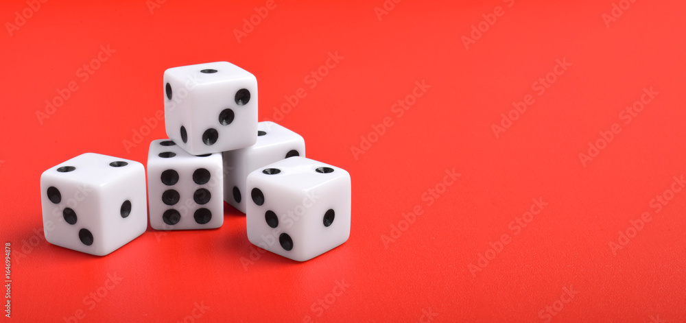 Many dices isolated on red background with copy space for text Many dices isolated on red background with copy space for text