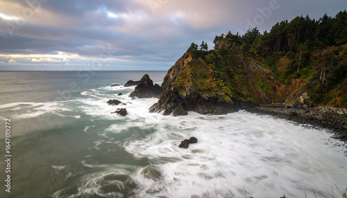 Coastal cliffs and crashing waves at sunset, Pacific Northwest