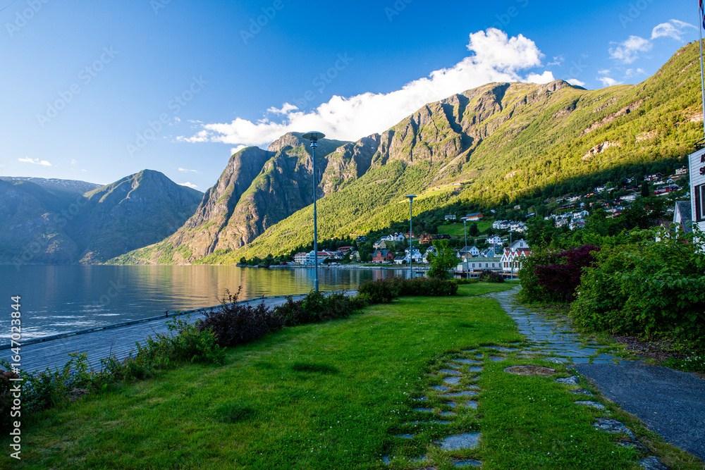Fototapeta premium Coastal Norwegian Village with Mountain and Fjord View