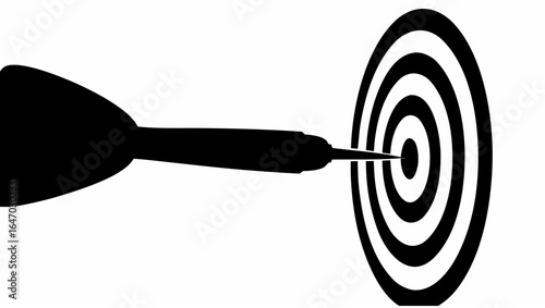 A black dart hitting the center of a black and white circular target with concentric rings showing success
