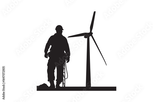 A lone worker wearing a hard hat and safety harness stands beside a tall wind turbine in a striking silhouette