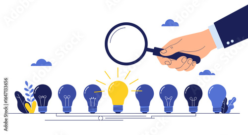 Hand holding magnifying glass over a bright glowing light bulb concept for innovation and finding solutions