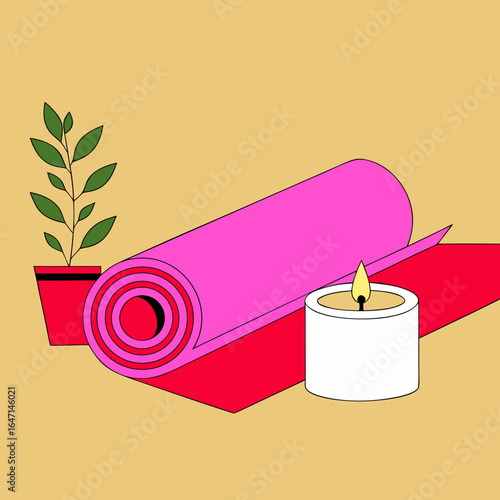 Rolled yoga mat and candle with leaves
