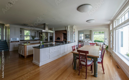 Wallpaper Mural Spacious light-filled open concept kitchen and dining area with islands and seating dining room kitchen island Torontodigital.ca