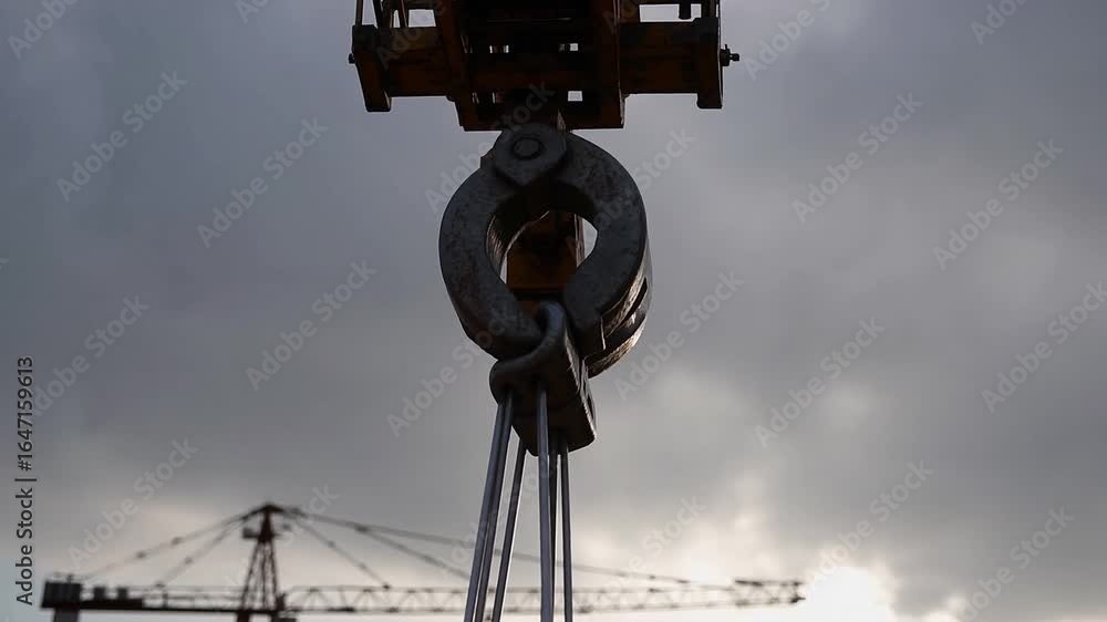 Majestic Crane Soaring Above Serene Construction Site, Perfect for Inspiring and Calm Projects. Majestic Crane Soaring Above Serene Construction Site, Perfect for Inspiring and Calm Projects.