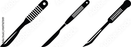 Three black scalpels with striped handles on a white background