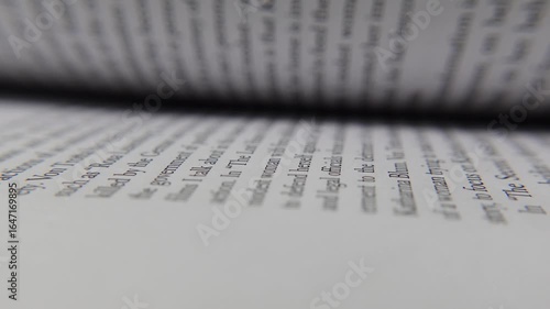 Book pages flipping rapidly, creating a smooth and seamless sheet transition.