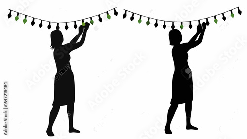 Two silhouettes of women hanging string lights with some green lights on a white background scene
