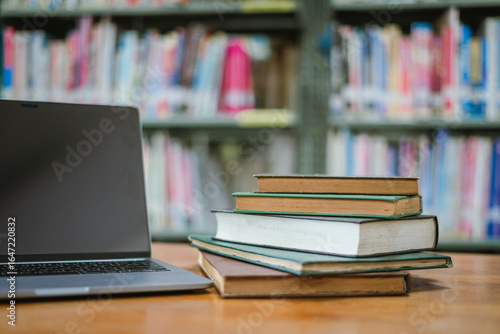 Books in the library and a laptop represent the concept of basic education.
