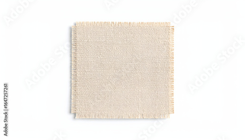 A single square swatch of natural linen fabric, highlighting its unique characteristic texture and frayed, raw edges.