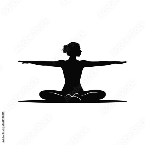 Silhouette of a woman in a yoga pose with arms outstretched