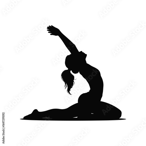 Silhouette of a woman in a graceful yoga pose