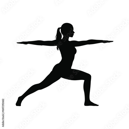 Silhouette of a woman in warrior ii yoga pose