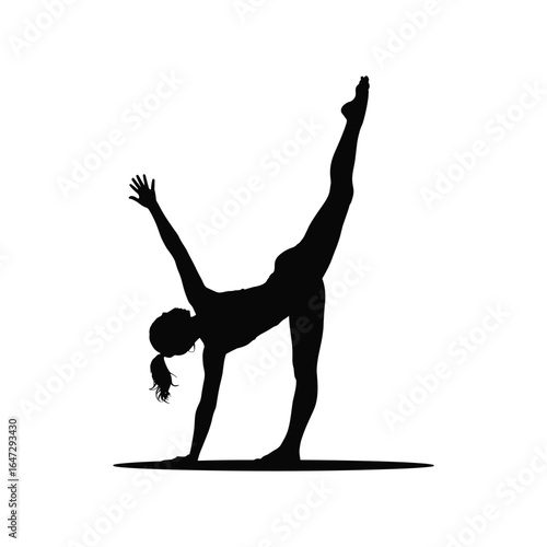 Silhouette of a woman performing a yoga pose on a mat