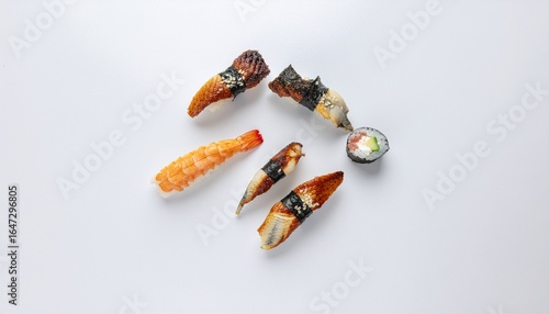 Wallpaper Mural Top-down view of a classic Japanese sushi set featuring unagi nigiri, tempura shrimp, and a maki roll isolated on a white background. Torontodigital.ca