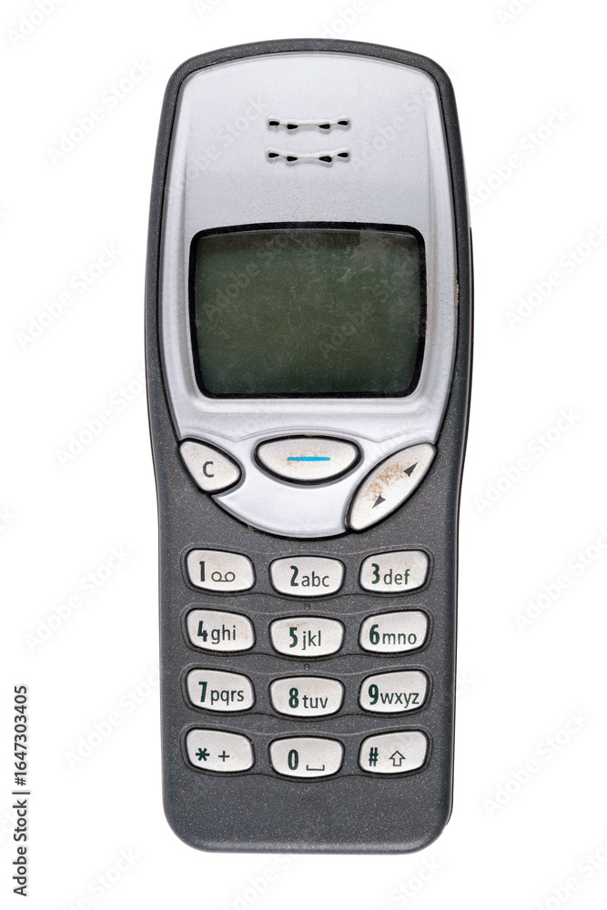 Classic mobile phone from the early 2000s with simple design isolated on white background.