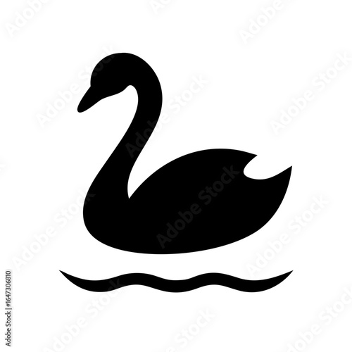 Black silhouette of a swan on water.
