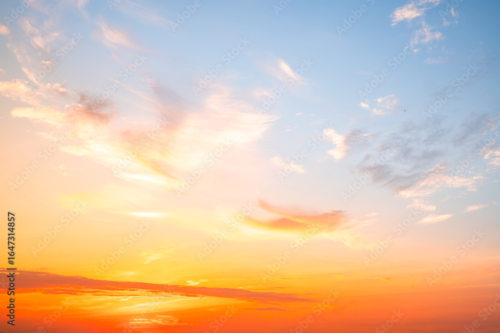 Fototapeta premium Beautiful , luxury soft gradient orange gold clouds and sunlight on the blue sky perfect for the background, take in evening,Twilight, Large size, high definition landscape photo