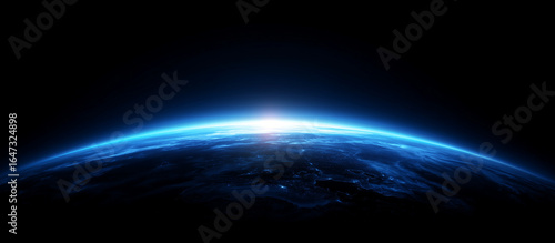 Blue glowing light beam on a black background with an earth shadow. Abstract blue gradient space background with a copy text area for design, banner, wallpaper, or poster. Stock photo, dark atmosphere
