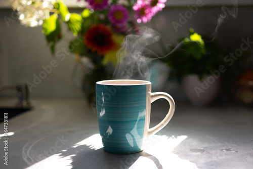 Photography A steaming cup of coffee sits on a kitchen counter, illuminated by sunlight