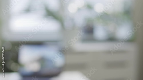 Hand of real estate agent handing over house keys to homeowner after successful deal in office. Close-up view