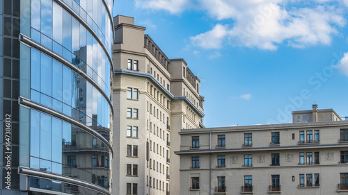 Skyscrapers with glass facades reflect other, old and new buildings, Panoramas from Rond Point place, Old buildings are transformed by building new ones over them. Old is reflected in new, interesting