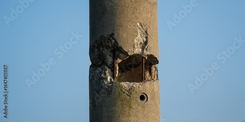Detail of a Damaged and Cracked Concrete Electric Pole