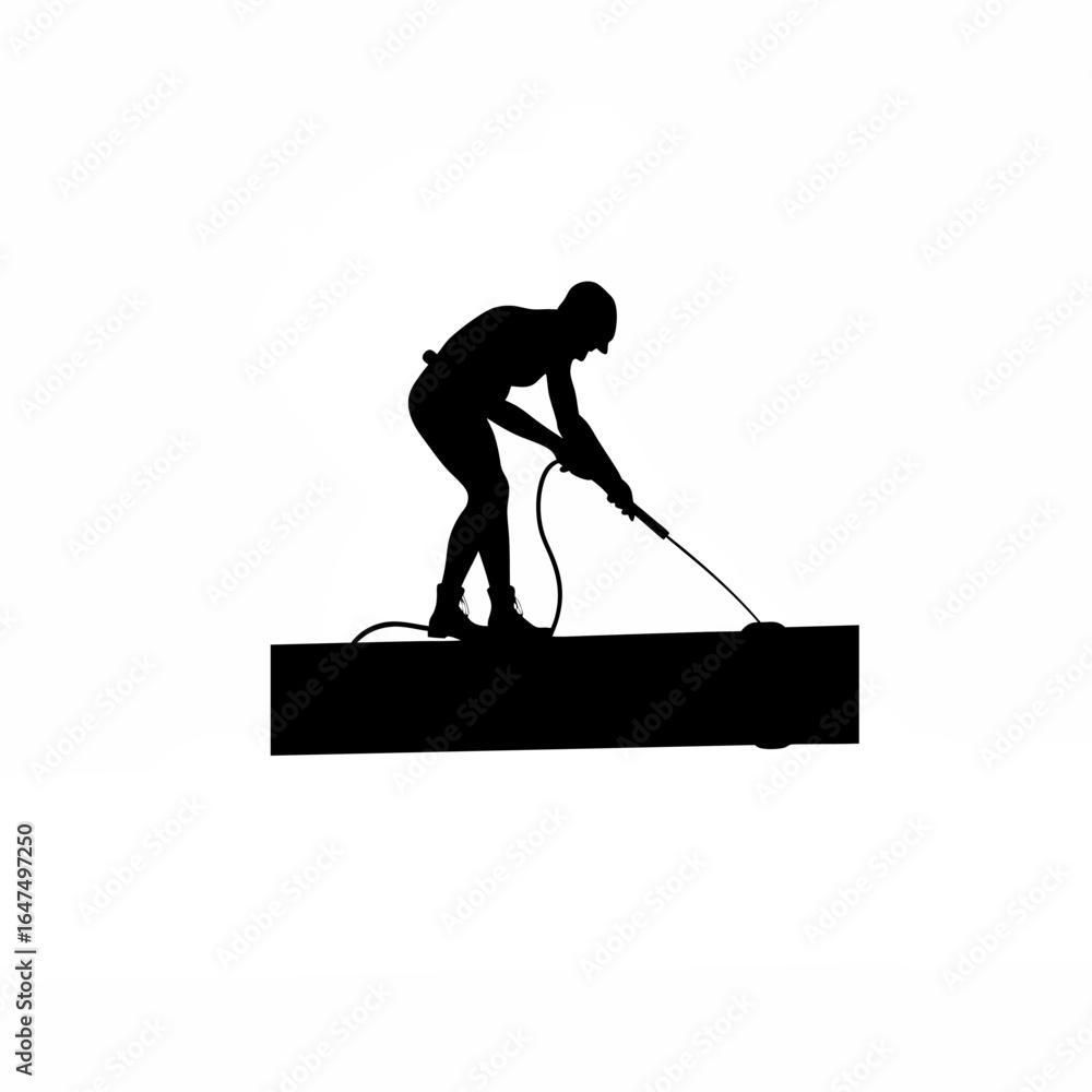 Fototapeta premium Silhouette of a skilled technician meticulously cleaning the surface of an industrial pipeline