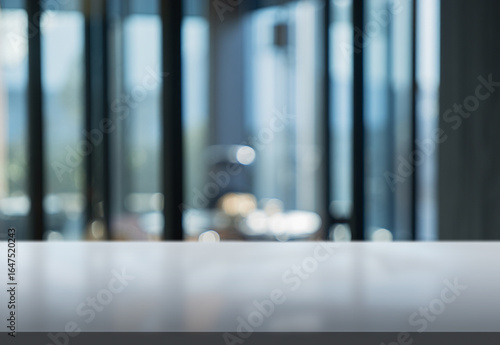 Slika na platnu Clean and modern workspace with a blurred background of glass windows reflecting