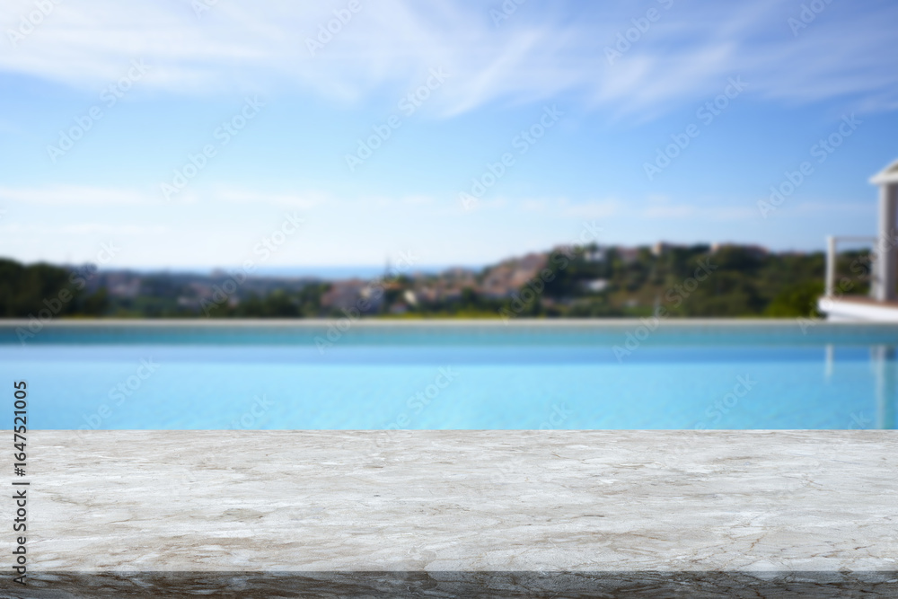 Fototapeta premium Beautiful view of a serene swimming pool and landscape under a clear blue sky in a luxurious setting