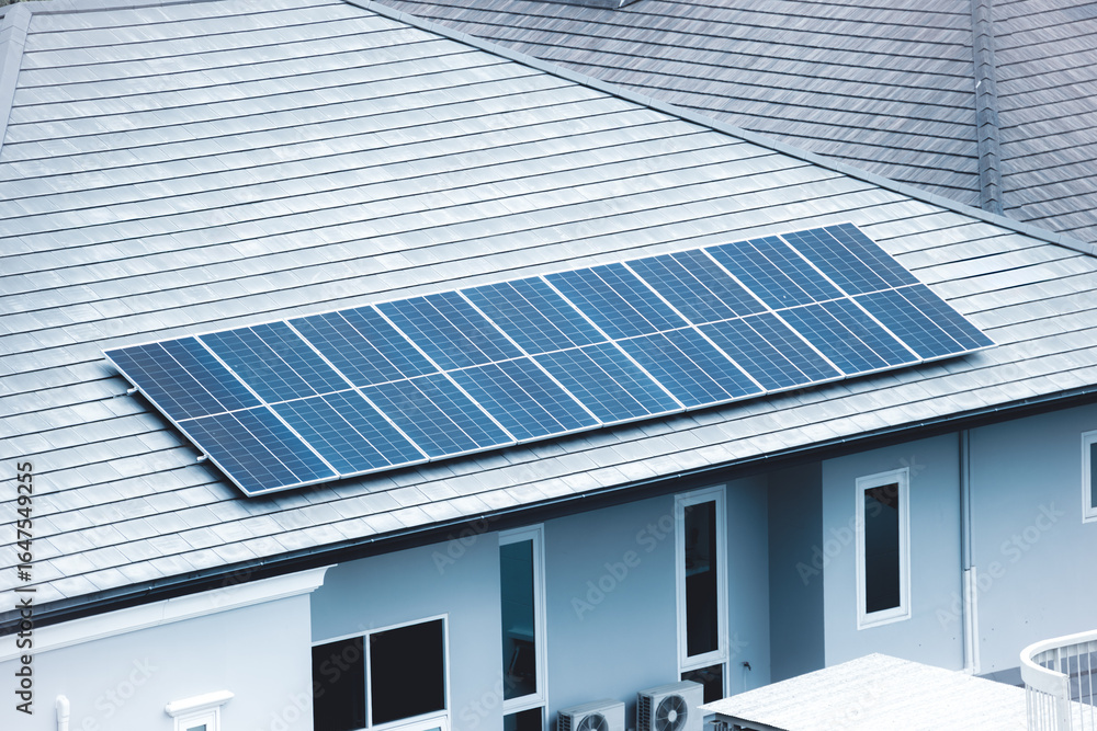 Fototapeta premium Solar roof top, Solar panel installed at modern house roof for saving home energy electricity cost.