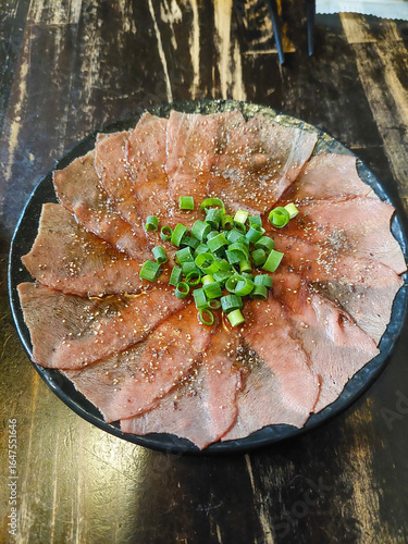 Raw beef with chopped green onions