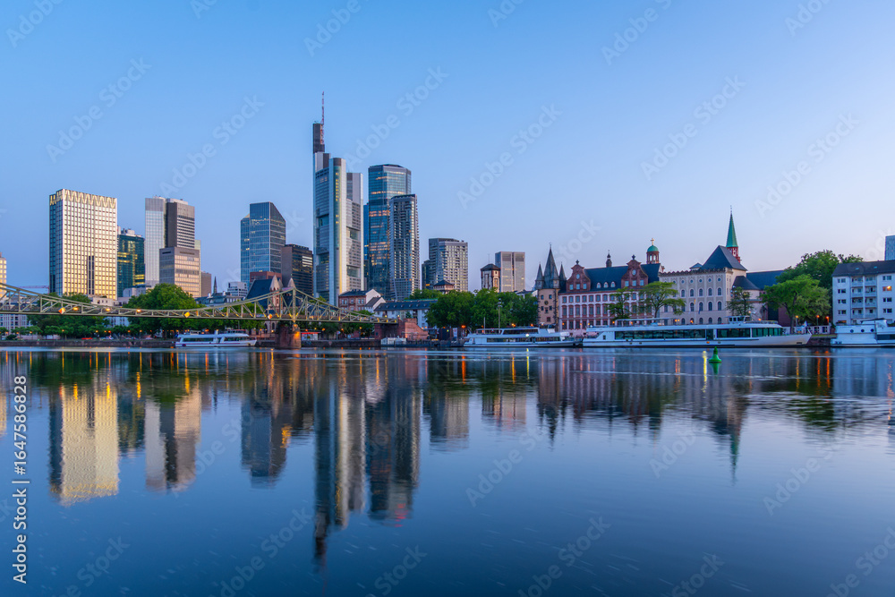 Fototapeta premium Frankfurt City Downtown Skyscrapers and Reflection in Main River at Morning Twilight. Blue Hour. Hesse, Germany