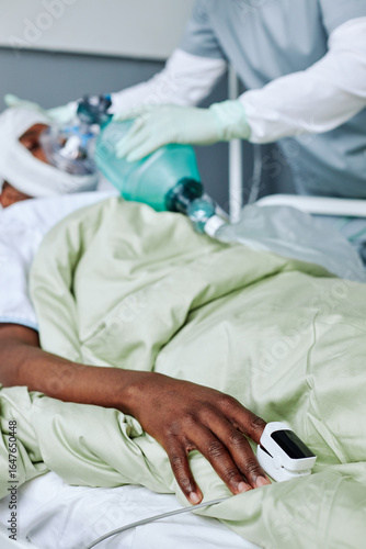 Wallpaper Mural Vertical selective focus shot of unrecognizable nurse giving artificial ventilation device to injured young Black man Torontodigital.ca
