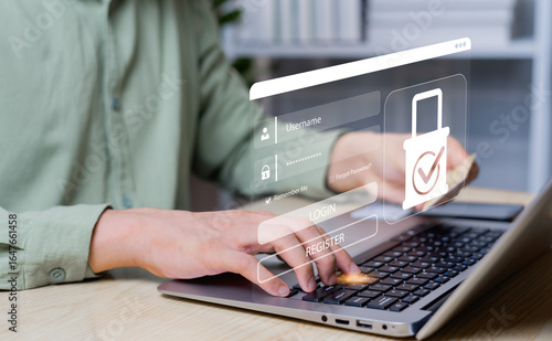 Billede på lærred Businessman securing data on laptop with encryption, network protection, secure login, and digital privacy to safeguard business secrets and ensure safe internet access