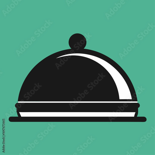 A black and white image of a silver tray with a lid. The tray is placed on a green background