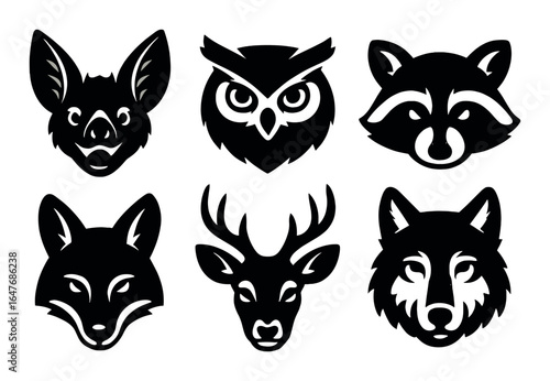 Silhouetted animal faces: bat, owl, raccoon, fox, deer, wolf on dark background