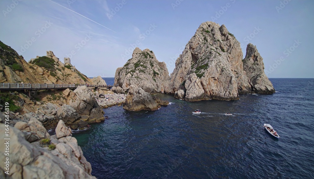 Picturesque rocky beach with clear blue water and gentle waves Picturesque rocky beach with clear blue water and gentle waves