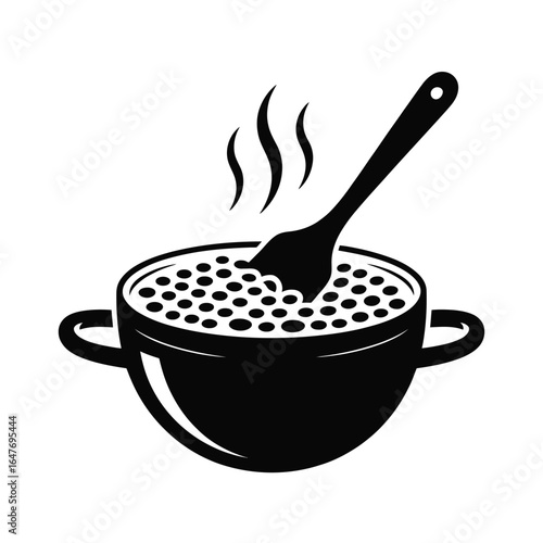 Bowl of hot soup with a spoon and steam rising