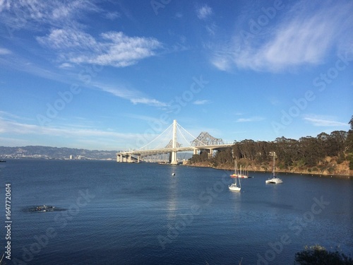 Eastern span of the Oakland Bay Bridge from Clipper Cove beach on Yerba Buena Island, San Francisco, California, USA