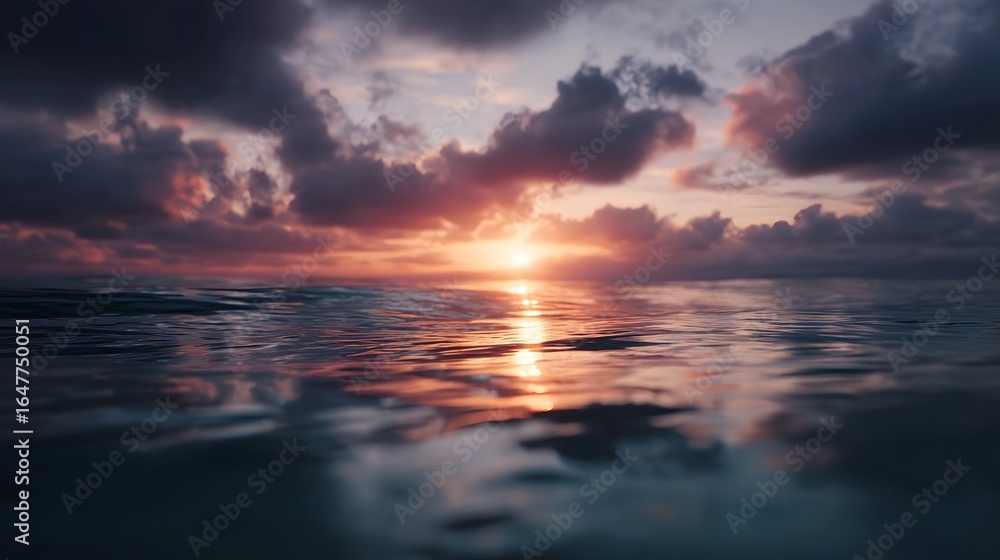 Naklejka premium Serene sunrise reflection on a calm sea