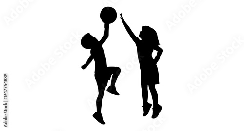Silhouette of two children playing basketball and high-fiving in a dynamic, joyful moment.