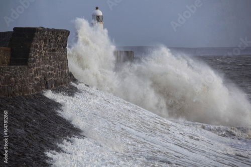 Giant waves hitting the sea wall and lighthouse at Porthcawl.
