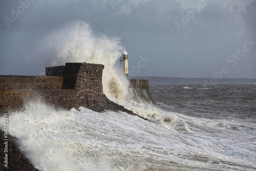 Giant waves hitting the sea wall and lighthouse at Porthcawl.
