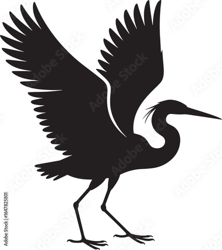 Black silhouette of a heron with wings spread bird