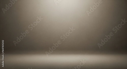 Elegant Taupe Studio Backdrop with a Soft Central Spotlight on a Textured Surface