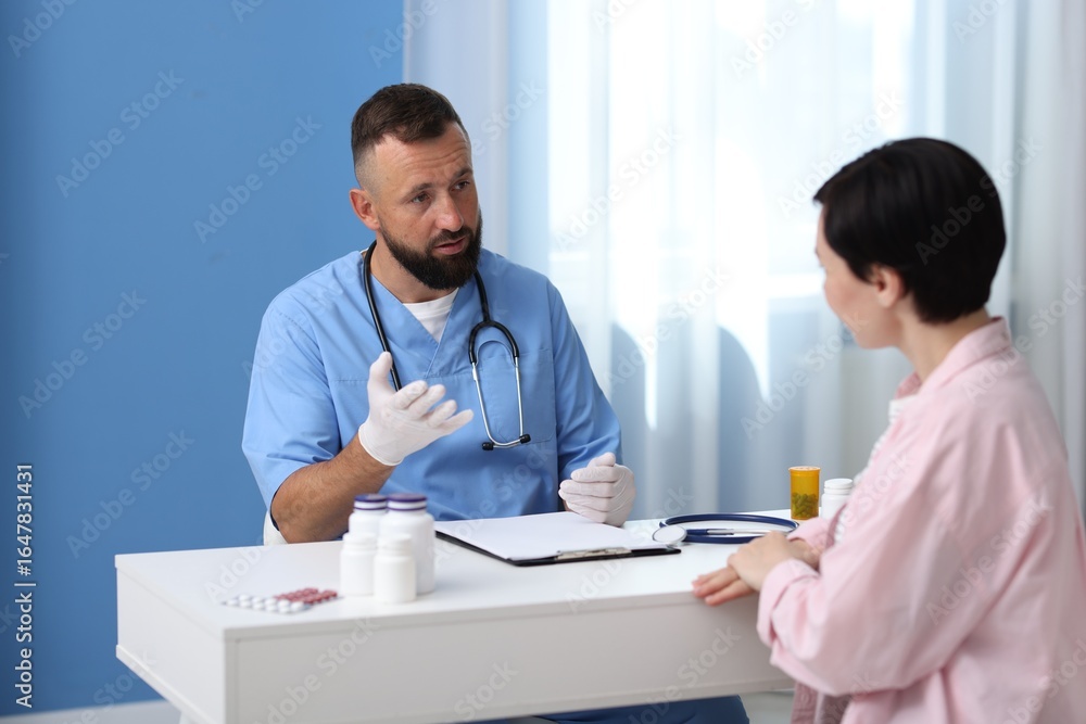 Fototapeta premium Woman having appointment with gastroenterologist in clinic